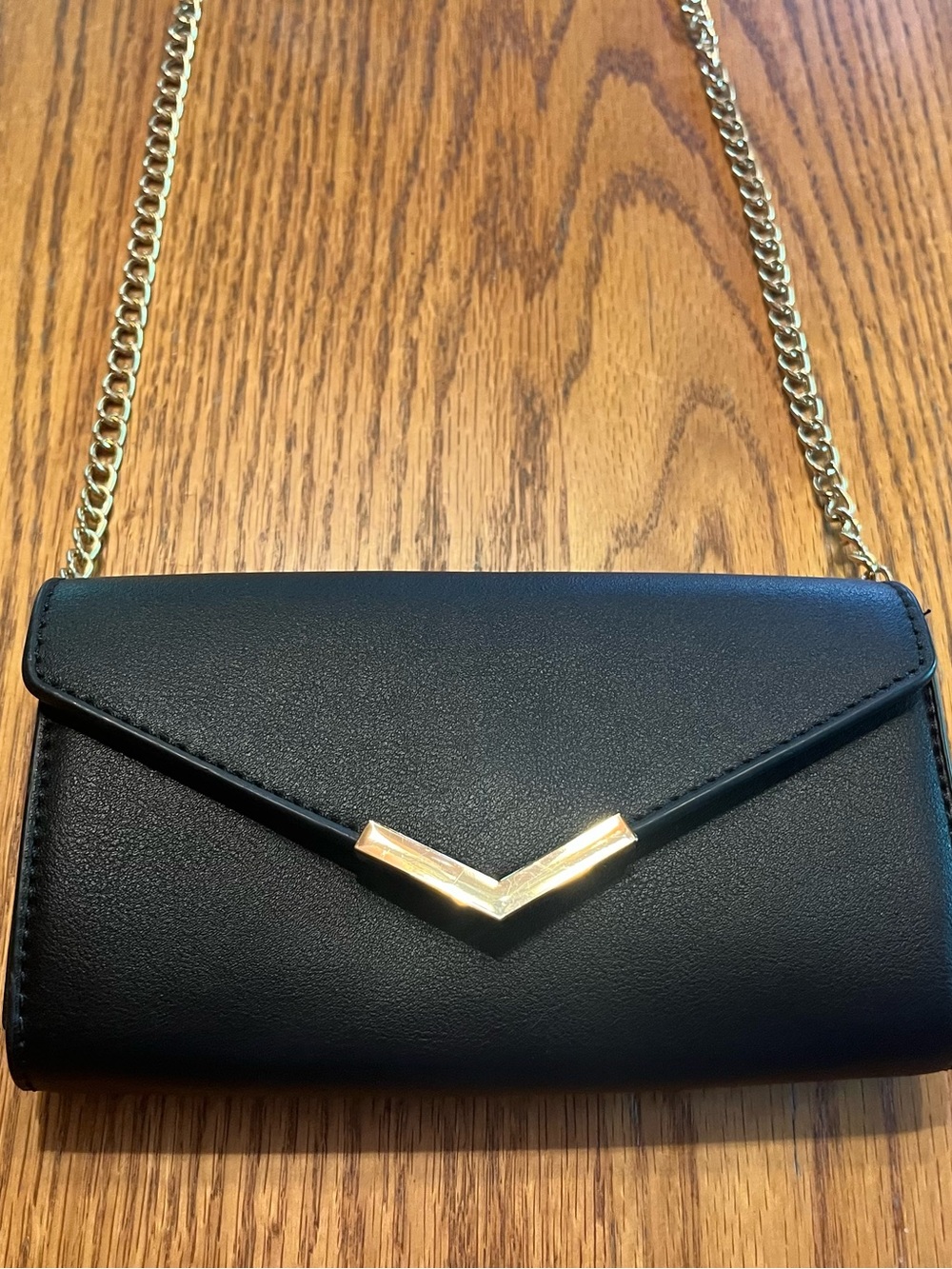 Black Crossbody Bag with Gold Chain and Accents